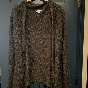 Long sleeved fringed shawl